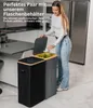 A woman is placing an item into a two-compartment trash bin in a kitchen. Náhľad obrázku produktu