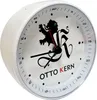 A close-up side view of a white analog alarm clock with a black lion logo and the brand name 'OTTO KERN' printed on its face. Produktbild-Vorschau