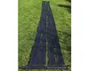 A solar collector mat laid out on grass. Produktbild-Vorschau