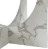 A close-up view of a marble-patterned table base. Voir les images du produit