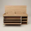 A wooden shoe cabinet with its lid open, revealing storage compartments. Produktbild-Vorschau