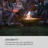 People sitting around a fire pit in a backyard at dusk. Produktbild-Vorschau
