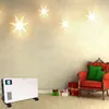 A white electric heater is placed on a wooden floor in a room decorated with star-shaped lights and Christmas gifts. Produktbild-Vorschau