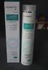A box and bottle of Medavita Puroxine Instant Anti-Dandruff Shampoo are displayed side-by-side on a dark gray surface. Produktbild-Vorschau