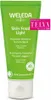 A green tube of Weleda Skin Food Light cream with a white cap, set against a white background. There is a pink award sticker on the upper right side of the tube. Voir les images du produit