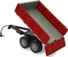 A red dump trailer with a gray interior, tilted upwards, attached to a black chassis with two sets of wheels. A black cable with a connector extends from the front of the chassis. Produktbild-Vorschau
