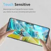 A hand holding a smartphone with a screen protector, displaying a video game. Produktbild-Vorschau