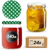 A collection of glass jars with lids, a box of jars, and a loose lid, presented on a white background. Podgląd zdjęcia produktu