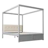 A modern four-poster bed with a gray frame and a cream upholstered headboard. Produktbild-Vorschau