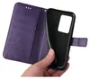 A hand is holding a purple floral flip phone case. Produktbild-Vorschau