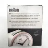 The image shows the packaging of a Braun radio-controlled alarm clock. The front of the box displays product information in English and German, along with a partial view of the clock itself. Anteprima dell’immagine prodotto
