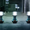 Three portable LED work lights are set up in a dimly lit, industrial-looking space, possibly a construction site or warehouse. Anteprima dell’immagine prodotto