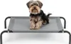 A small dog sits on a raised pet bed against a white background. Anteprima dell’immagine prodotto