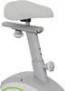 A close-up view of the seat and adjustment mechanism of a stationary exercise bike. Produktbild-Vorschau