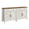 A white and brown sideboard with a wooden top, featuring two drawers and two cabinet doors with a criss-cross design on each. Produktbild-Vorschau