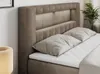 A close-up view of a bed with a headboard and pillows. Produktbild-Vorschau
