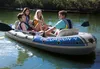 Four people are enjoying a day on the water in an inflatable boat. Podgląd zdjęcia produktu