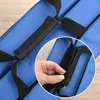A close-up view of a blue gym mat with a black handle and straps. A hand is shown interacting with the straps. Produktbild-Vorschau