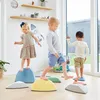 Children playing on balance stones in a room. Anteprima dell’immagine prodotto