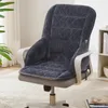 A dark gray quilted seat and back cushion set is placed on an office chair. Voir les images du produit