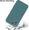A teal phone case is shown falling and impacting a cracked white surface, illustrating its shock-absorbing feature. Produktbild-Vorschau