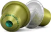 Two coffee capsules are shown against a white background. One capsule is green and has text around it, while the other is silver and has a foil lid with text. Produktbild-Vorschau