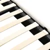 A close-up view of the wooden slats and black metal frame of a bed base. Anteprima dell’immagine prodotto