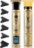 Two gold-colored hair clippers with ornate designs are displayed side-by-side against a white background. The clipper on the left has a digital display showing battery life and available time. The clipper on the right features a graphic of scissors and a p Náhled obrázku produktu