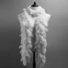 A white feather boa draped around a mannequin against a gray background. Voir les images du produit