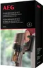 The packaging for an AEG Performance Kit, featuring a hand holding a vacuum cleaner. The background is blurred, suggesting an indoor setting. Produktbild-Vorschau