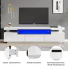 A modern white TV cabinet with blue LED lighting, shown in a living room setting with a television on top. Below the main image are three close-up detail shots of the cabinet's features. Produktbild-Vorschau