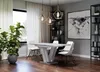 A modern dining room with a table, chairs, and decorative elements. Produktbild-Vorschau