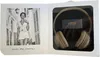 A product box with a black window showing headphones and a black and white photo of a woman. Náhľad obrázku produktu