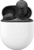 A pair of black Google Pixel Buds Pro wireless earbuds are shown inside their white charging case. Produktbild-Vorschau