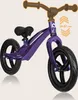 A purple balance bike is shown against a light beige background. The handlebars are a lighter brown color. Produktbild-Vorschau