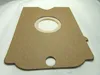 A flat, brown cardboard cutout with a circular opening and a smaller circular hole at the bottom, lying on a white textured surface. Produktbild-Vorschau