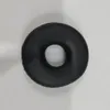 A black donut-shaped cushion is shown from a top-down view against a white background. Voir les images du produit