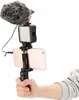 A hand holding a smartphone with a microphone and LED light attached, set up for vlogging. Produktbild-Vorschau