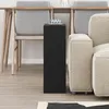 A black side table is placed next to a beige sofa and in front of dining chairs. Produktbild-Vorschau