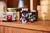 Miniature LEGO castles and figures displayed on a wooden shelf. Produktbild-Vorschau