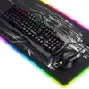 A gaming keyboard, mouse, and mousepad are displayed on a desk mat with a dragon graphic. The keyboard and mousepad have RGB lighting. Produktbild-Vorschau