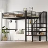 A loft bed with stairs and storage is set up in a bedroom with a sofa underneath. A plant and a lamp are also visible. Podgląd zdjęcia produktu