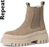 A single taupe colored boot with a thick sole is shown against a white background. Podgląd zdjęcia produktu