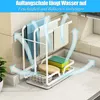 A kitchen organizer with towels, sponges, and a brush is shown on a countertop, with blue arrows indicating airflow. Produktbild-Vorschau