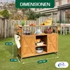 An outdoor kitchen cart is shown on a green lawn with a wooden fence and a house in the background. Produktbild-Vorschau