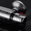 A close-up of a chrome shower thermostat with water droplets on it, set against a black background. Produktbild-Vorschau