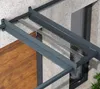 Close-up view of a modern door canopy attached to a building facade. Produktbild-Vorschau