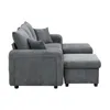 A side view of a grey sectional sofa with an ottoman. Produktbild-Vorschau
