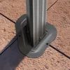 Close-up of a metal pole base attached to a tiled surface. Anteprima dell’immagine prodotto