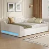 A white upholstered daybed with tufted headboard and LED lighting at the base, set in a room with decorative wall molding and curtains. Anteprima dell’immagine prodotto